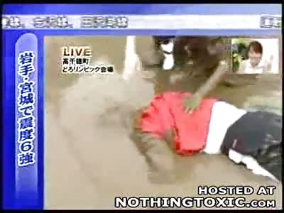 Japanese Reporter breaks his Neck on Live TV