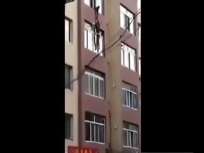 Wife falls off building after husband slips grip out of Exhaustion.