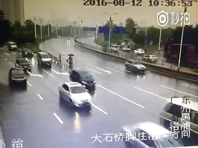 Drifting car hits rider to ground 