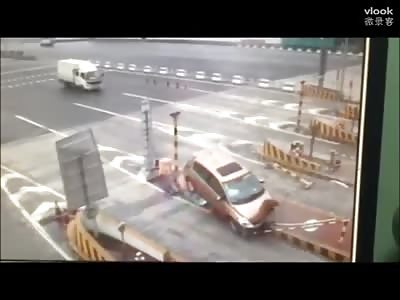 Car hits road divider head On
