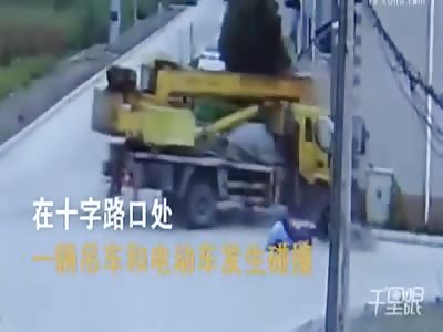  Crane truck crashes into a motorcyclist and a building 