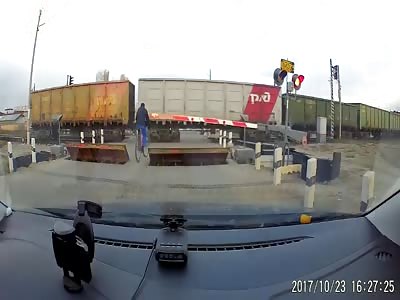 Bicyclist gets hit by a second train 
