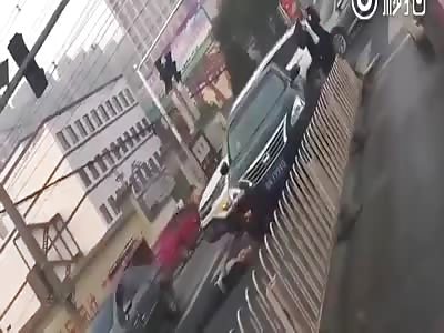 Man run over by black car after hit by white one