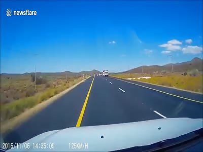  Trailer blown by wind smashes oncoming car windscreen  