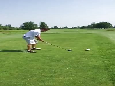 Golfer hits a birdy.