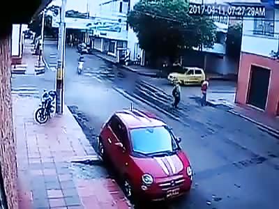 Woman on motorcycle is run over