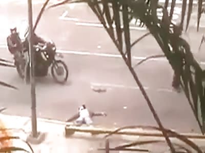Man convulses while the Bolivarian National Guard assaults him