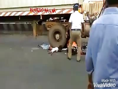 Motorcycle accident squashed by truck