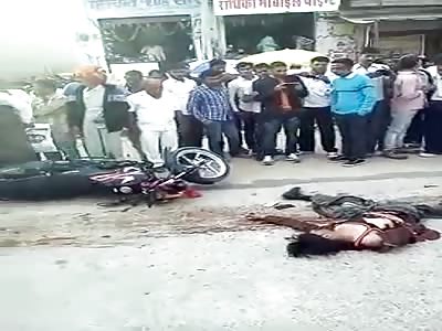 Woman crushed by truck