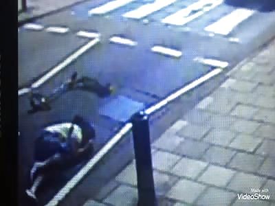 car crashes woman on devil's skateboard leaving her lying down and runs away