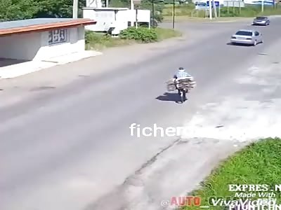 old man on bicycle is wound up by car