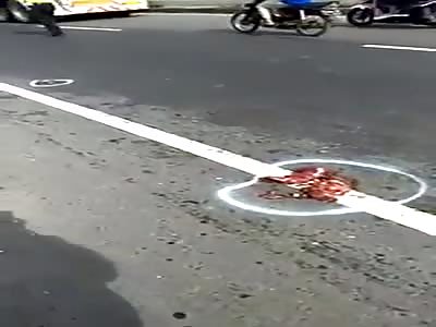 PIECES OF BODY SPREADED IN THE PAVEMENT