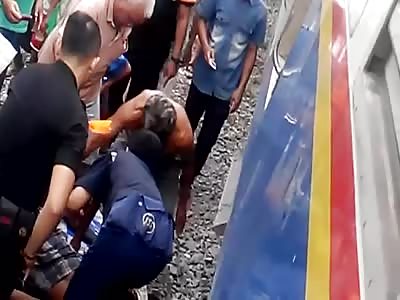 BODY OF MAN IS DROP UNDER THE TRAIN
