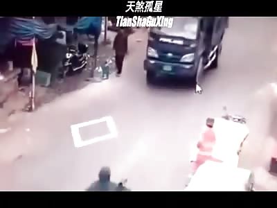Scooter Boy Run Over by a Dump Truck when Avoiding a Pedestrian