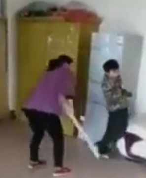 Asian Teacher Repeatedly Beating a Nine-Year-Old Boy Because 'He Eats Too Slowly His Lunch'