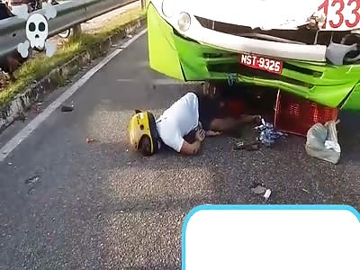 man smashed under bus