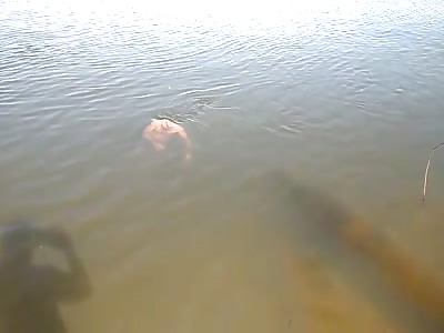 Body floating in the lake