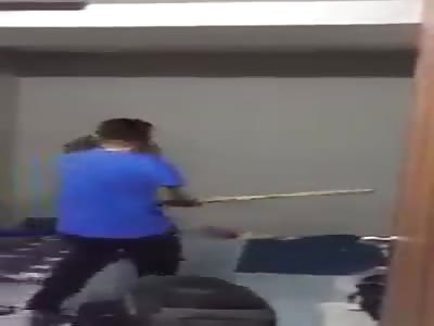 These Chinese hitting the friend with a stick