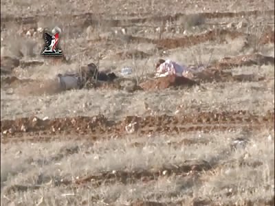 Daesh terrorists right after the attack on the Syrian army surgeon points near the pit east of Homs Syria future 