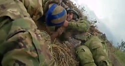 UA assault on a RU position. A UA trooper is wounded during the attack