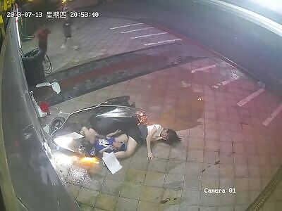 Chinese young woman with her little boy crushed into the wall 