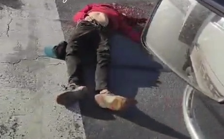 Cyclist head crushed on the street like a watermelon 