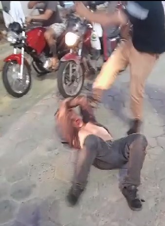 Thief beaten with helmet and kicks