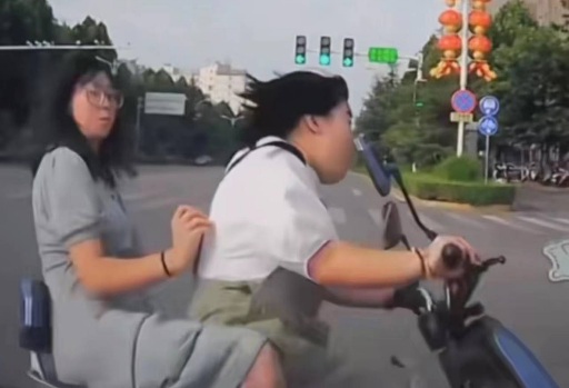 Two Chinese girls on scooter crushed by speeding car