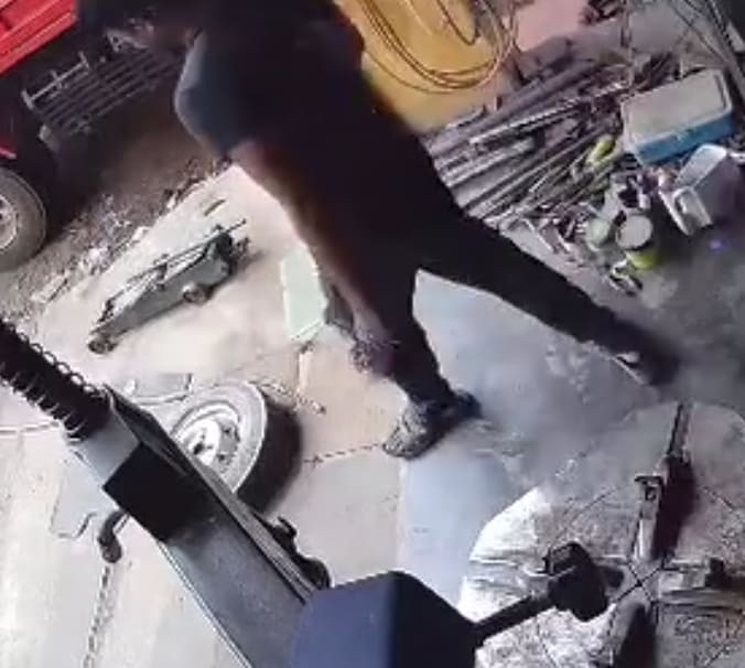 Tire Explodes In Mechanics Face