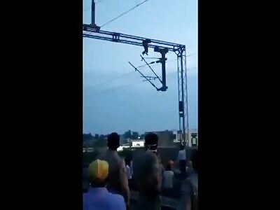 Man commits suicide by touching the train's high-voltage lines.