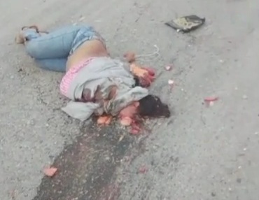 Female motorcyclist crushed under big truck 