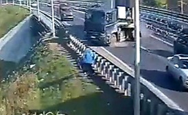 man managed to jump away from a heavy truck that had lost control