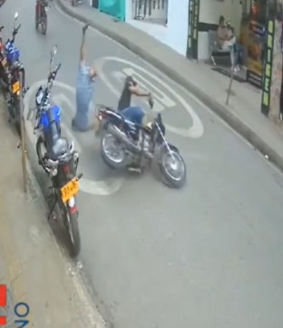 lady turned somersault when caught by biker