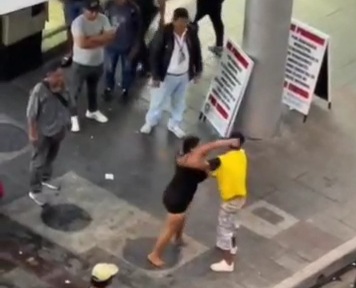 Drunk couple fighting in street 