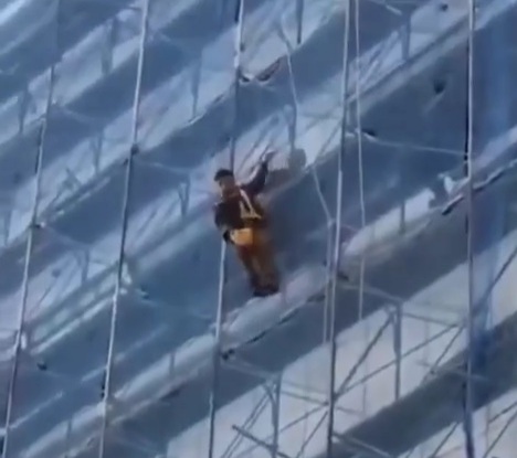 Chinese Worker Wants Crowd to Watch Him Jump