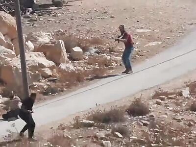 A settler fires at an unarmed Palestinian