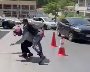 Motorcyclist fighting police