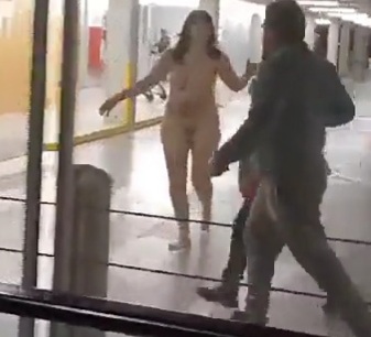 Totally naked woman walks through airport and begins to attack travele