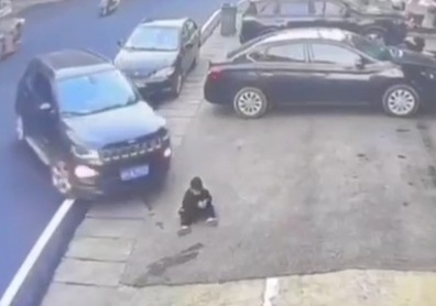 Little boy playing on the ground crashed by car 