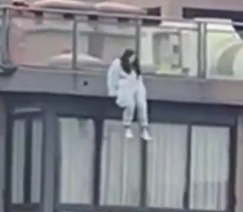 Suicidal person jumps off a building when he sees the rescuers.