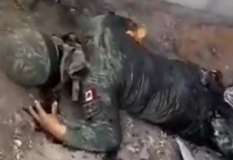 Dead body of drug gang members burned by civilian after a rebellion against them in Mexico 