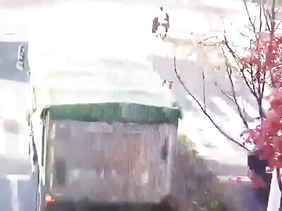 Chinese on a scooter getting crushed by a truck. China, 11 December 20