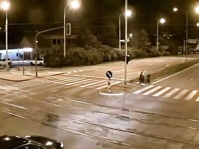 A woman is hit by a car while crossing the street
