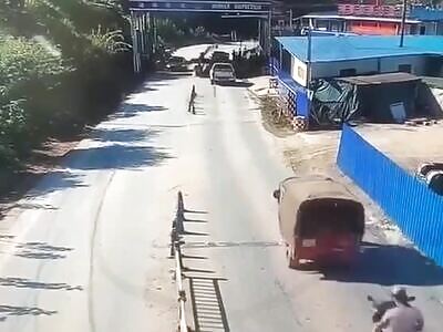 Concrete mixer smearing dude on scooter across the road. China