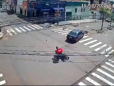 Group of bikers run a red light and get hit by a car. Brazil