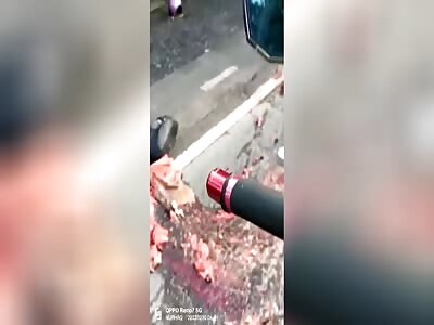 Biker after collision and dragged by truck