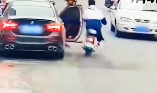 Chinese man on electric scooter crashed under car