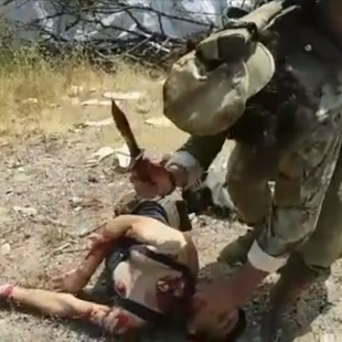 Taliban Savagely Behead Captured Civilian.