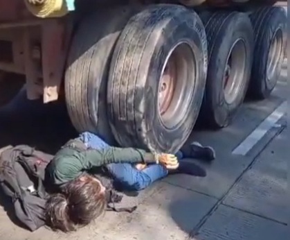 Young girl on bicycle crashed under truck wheels 