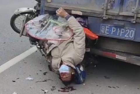 Old man on motorcycle crashed and stuck in the back of truck 